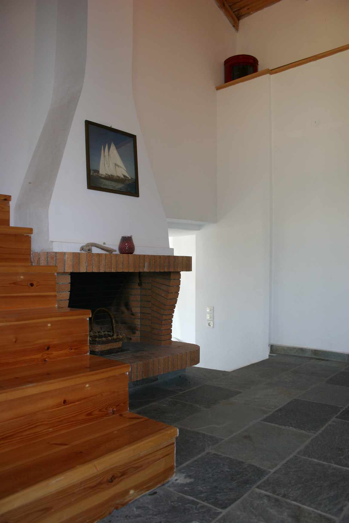 Wooden stairs lead to the bedroom